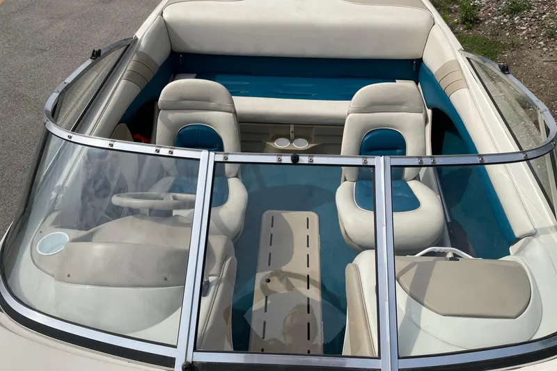 Slide: The Image of Interior of a 1995 Glastron SSV 175 boat with blue and beige seating. - 5