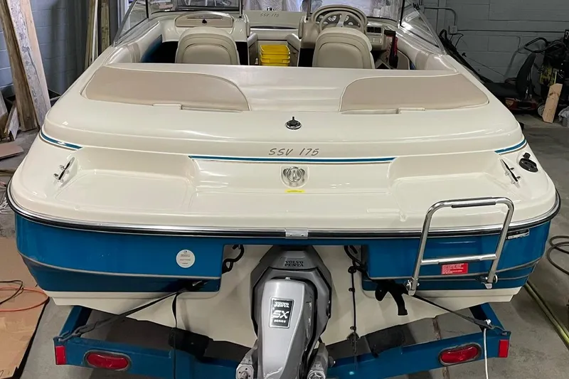 Slide: The Image of 1995 Glastron SSV 175 boat with Volvo Penta engine, parked indoors on a trailer. - 8
