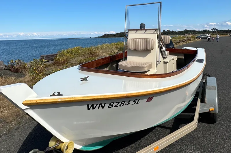 Slide: The Image of Custom Stambaugh Redwing 18' boat, 2015 model, on trailer by the sea. - 1