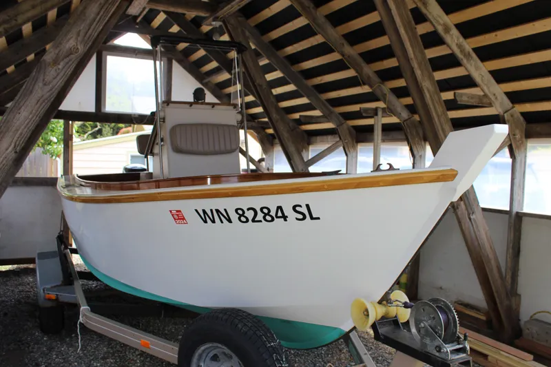 Slide: The Image of Custom 2015 Stambaugh Redwing 18' boat on trailer in wooden shed. - 10