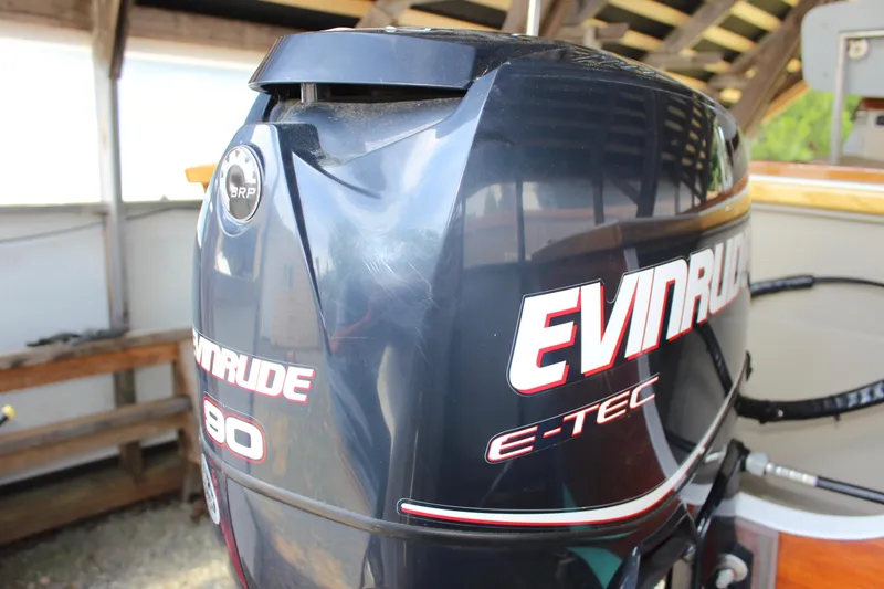 Slide: The Image of Evinrude E-TEC 90 outboard motor on 2015 Custom Stambaugh Redwing 18' boat. - 14