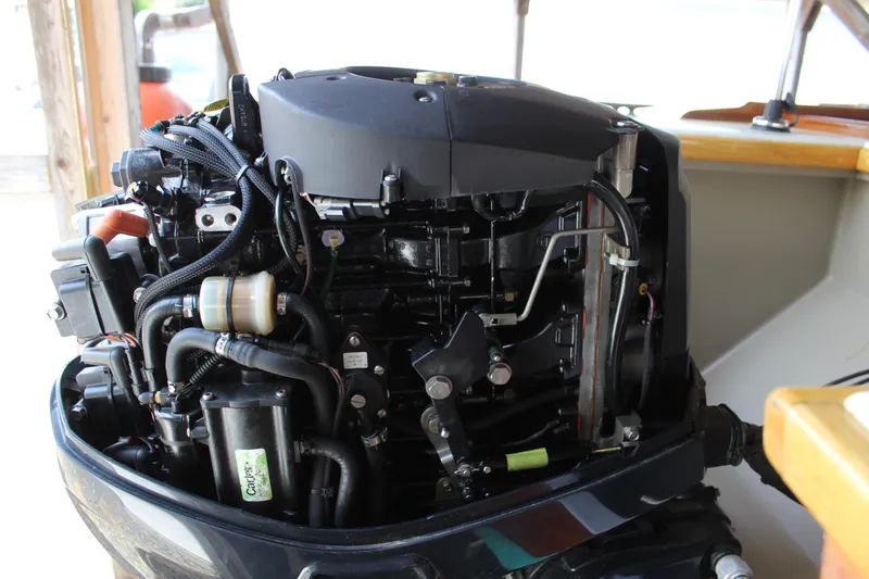 Slide: The Image of Close-up of a 2015 Custom Stambaugh Redwing 18' boat engine, showcasing intricate components. - 16