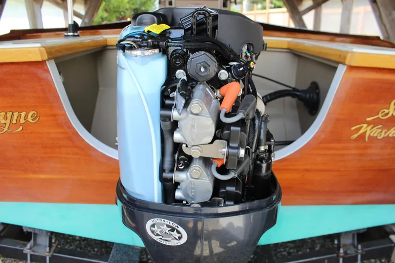 Slide: The Image of Outboard motor on a 2015 Custom Stambaugh Redwing 18' boat, showcasing engine details. - 17