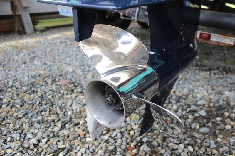 Slide: The Image of Close-up of a shiny boat propeller on a 2015 Custom Stambaugh Redwing 18'. - 18