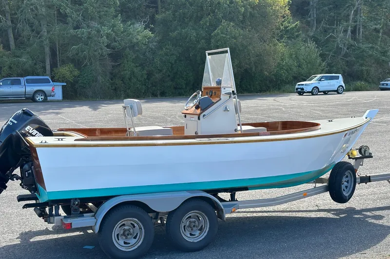 Slide: The Image of Custom Stambaugh Redwing 18' boat, 2015 model, on trailer in parking lot. - 3