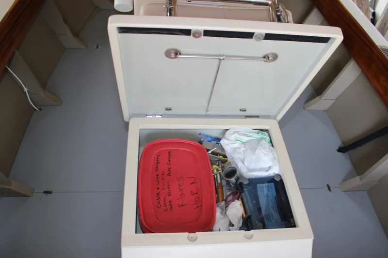Slide: The Image of Storage compartment on a 2015 Custom Stambaugh Redwing 18' boat with tools and supplies. - 30