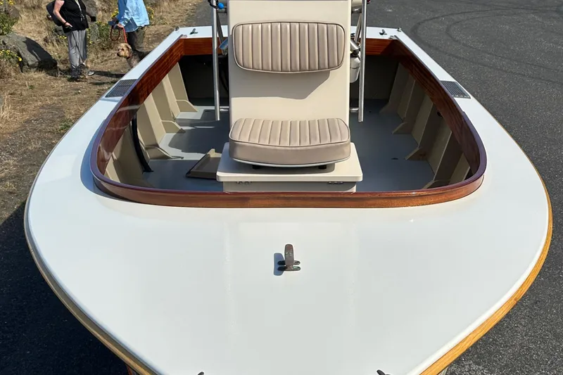 Slide: The Image of Custom Stambaugh Redwing 18' boat, 2015 model, with beige seating and wooden trim. - 5