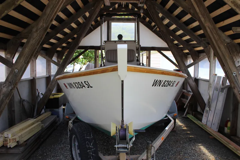 Slide: The Image of Custom Stambaugh Redwing 18' boat from 2015 in a wooden boathouse. - 9