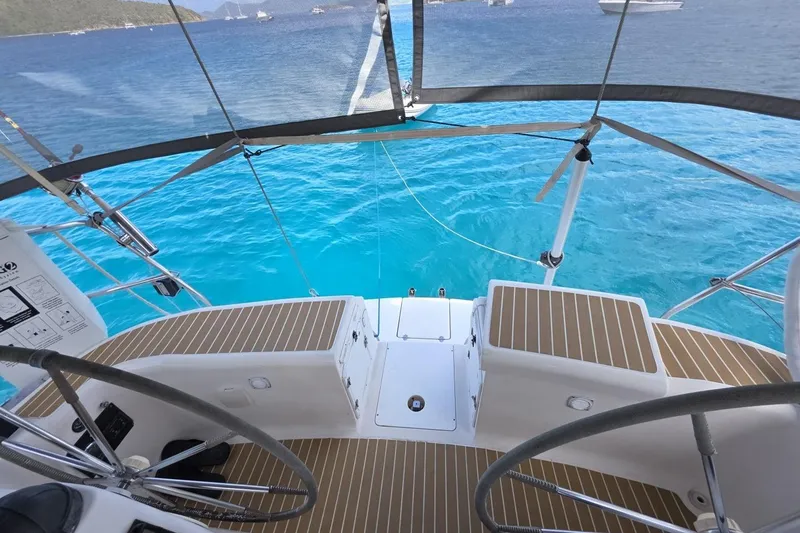 Slide: The Image of Cockpit view of 2003 Bavaria 44 sailboat on clear blue water. - 11