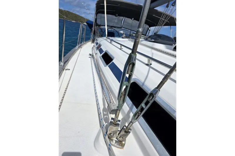 Slide: The Image of Sailboat deck view of 2003 Bavaria 44, showcasing rigging and sleek design. - 18