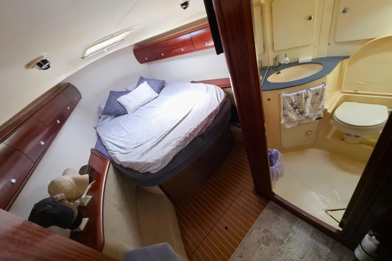 Slide: The Image of Cozy cabin interior of 2003 Bavaria 44 yacht with bed and bathroom. - 25