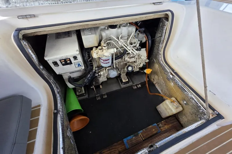 Slide: The Image of Engine compartment of a 2003 Bavaria 44 yacht, showcasing mechanical components. - 32