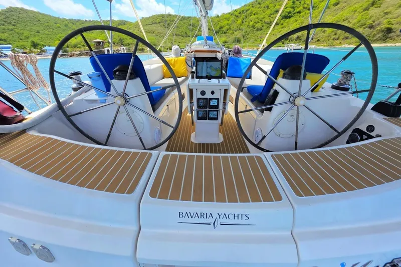 Slide: The Image of Cockpit view of a 2003 Bavaria 44 yacht with dual steering wheels. - 8