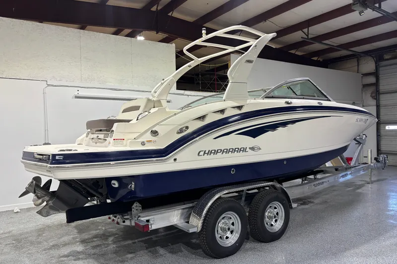 Slide: The Image of 2015 Chaparral 244 Sunesta boat on trailer in indoor storage facility. - 3