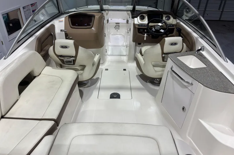 Slide: The Image of Interior of a 2015 Chaparral 244 Sunesta boat with seating and helm. - 6
