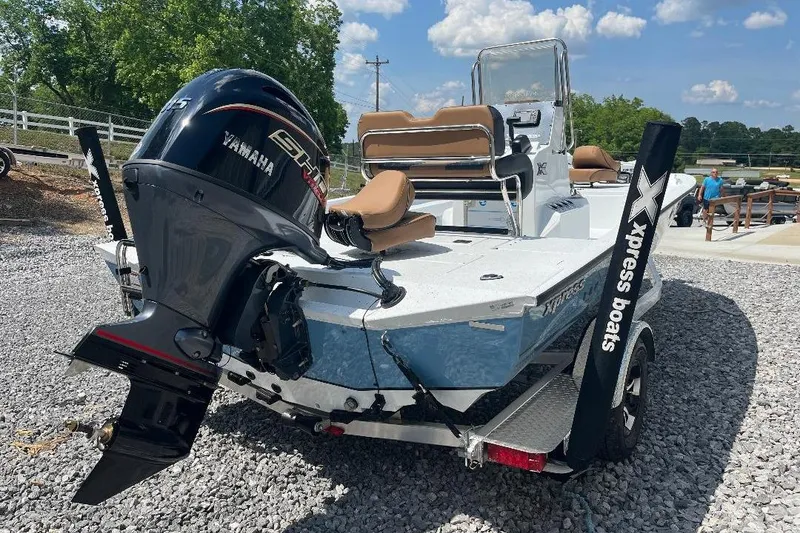 Slide: The Image of 2026 Xpress H20B Bay boat with Yamaha engine on trailer, parked outdoors. - 11