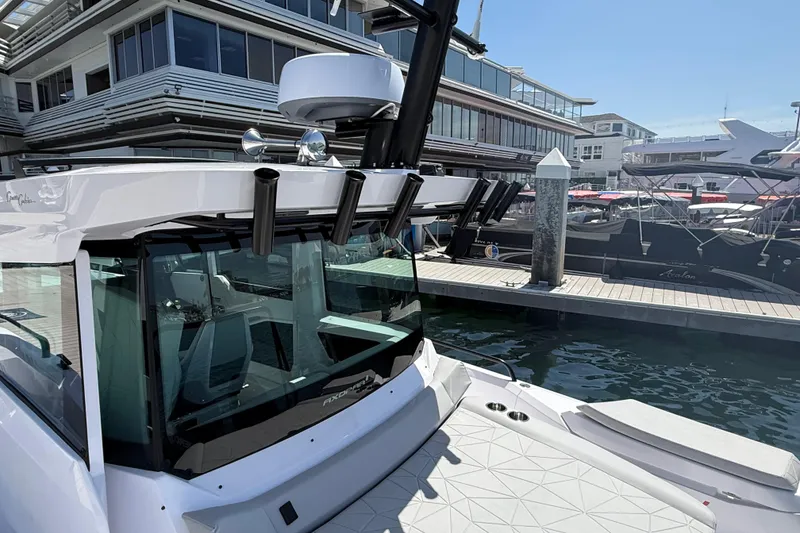 Slide: The Image of 2025 Axopar 29 XC Cross Cabin docked at a marina, showcasing sleek design and modern features. - 15