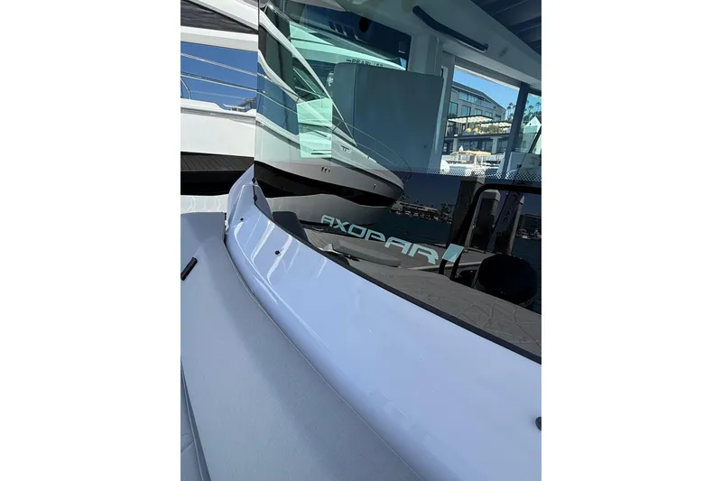 Slide: The Image of 2025 Axopar 29 XC Cross Cabin boat, showcasing sleek design and modern features. - 16