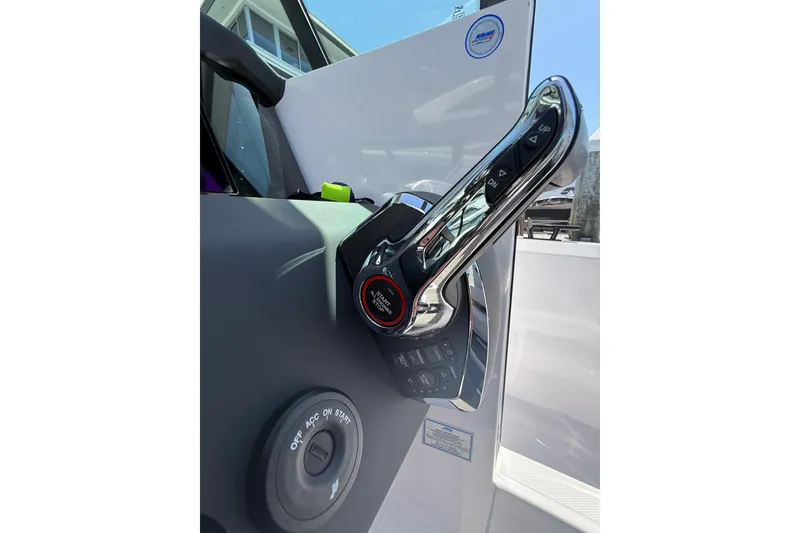 Slide: The Image of 2025 Axopar 29 XC Cross Cabin throttle control and ignition switch detail. - 27