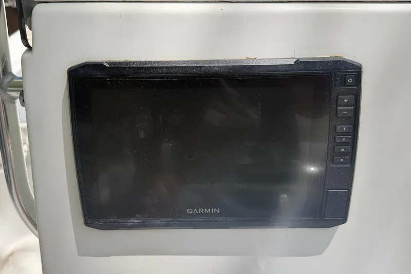 Slide: The Image of Garmin marine GPS device on a 2012 Pathfinder 2200 T boat dashboard. - 8