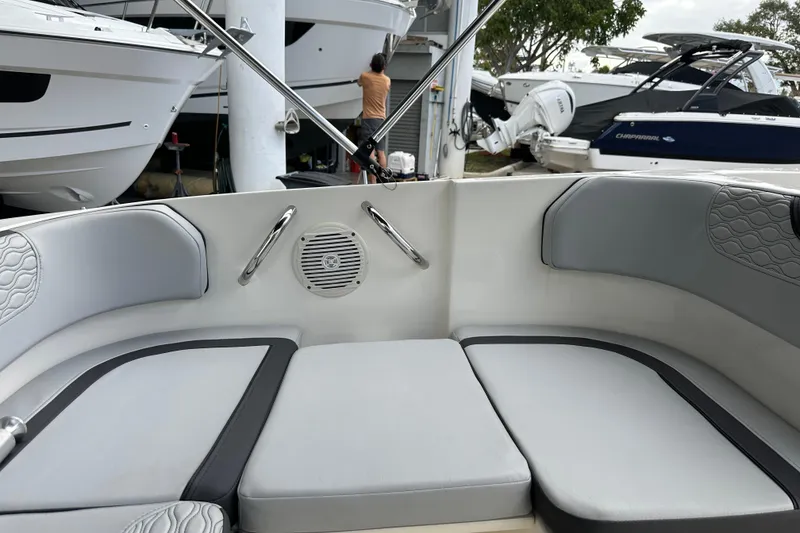 Slide: The Image of Interior view of 2023 Bayliner M17 boat with cushioned seating and speaker. - 10