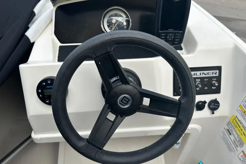 Slide: The Image of 2023 Bayliner Element M17 steering wheel and dashboard controls. - 15