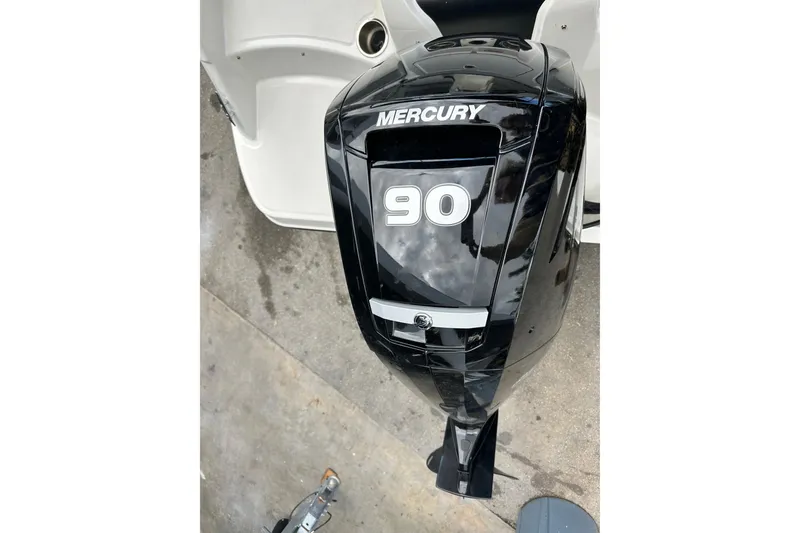 Slide: The Image of Mercury 90 outboard motor on 2023 Bayliner M17 boat, viewed from above. - 26