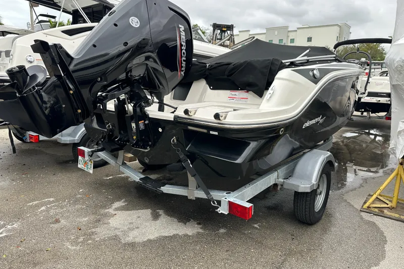 Slide: The Image of 2023 Bayliner Element M17 boat on trailer with Mercury outboard motor. - 6