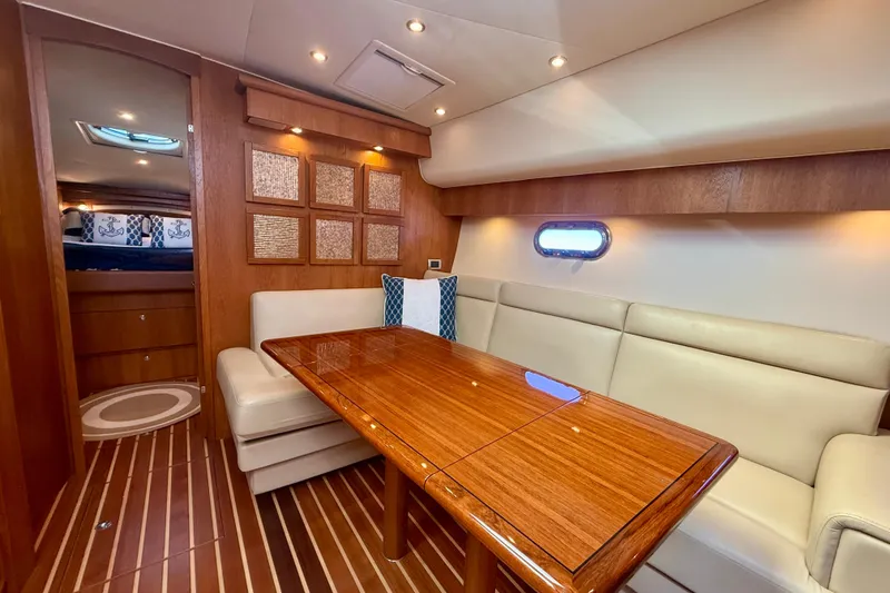 Slide: The Image of Luxurious interior of 2012 Tiara Yachts 4500 Sovran with elegant wood finishes and plush seating. - 11