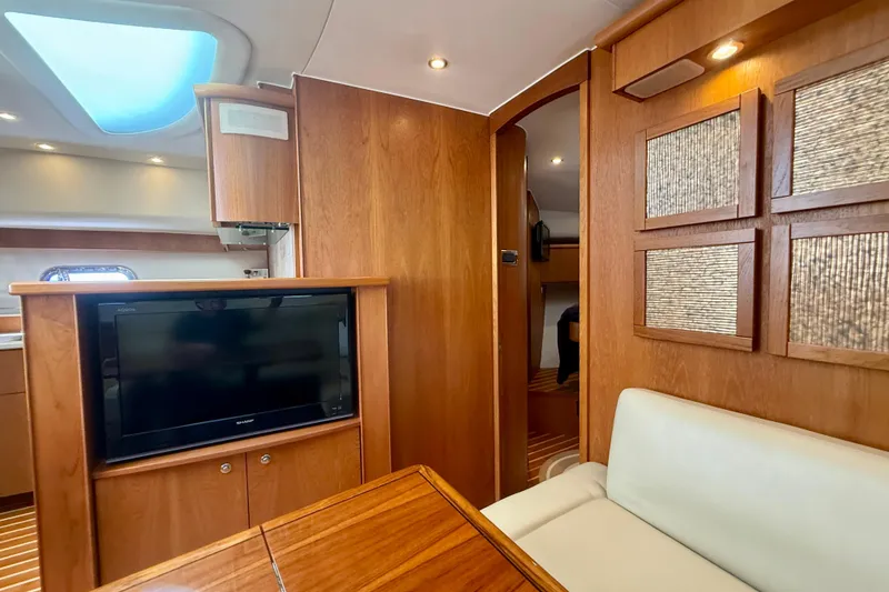Slide: The Image of Luxurious interior of 2012 Tiara Yachts 4500 Sovran with wood paneling and modern amenities. - 16
