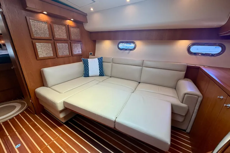 Slide: The Image of Luxurious interior of 2012 Tiara Yachts 4500 Sovran with beige leather seating. - 18