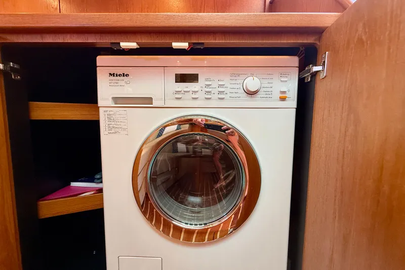 Slide: The Image of Miele washing machine inside Tiara Yachts 4500 Sovran, 2012 model, wooden cabinet. - 21