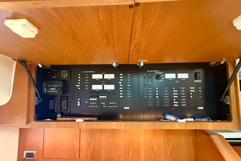 Slide: The Image of Electrical control panel inside 2012 Tiara Yachts 4500 Sovran, showcasing AC and DC systems. - 22