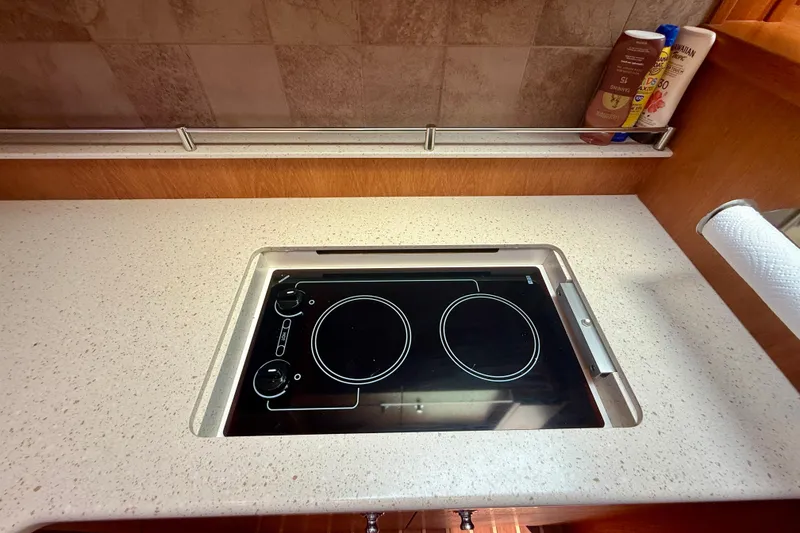 Slide: The Image of Modern kitchen cooktop on 2012 Tiara Yachts 4500 Sovran, featuring sleek design and functionality. - 25