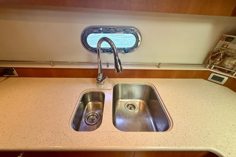 Slide: The Image of Tiara Yachts 4500 Sovran 2012 kitchen sink with modern faucet and countertop. - 26