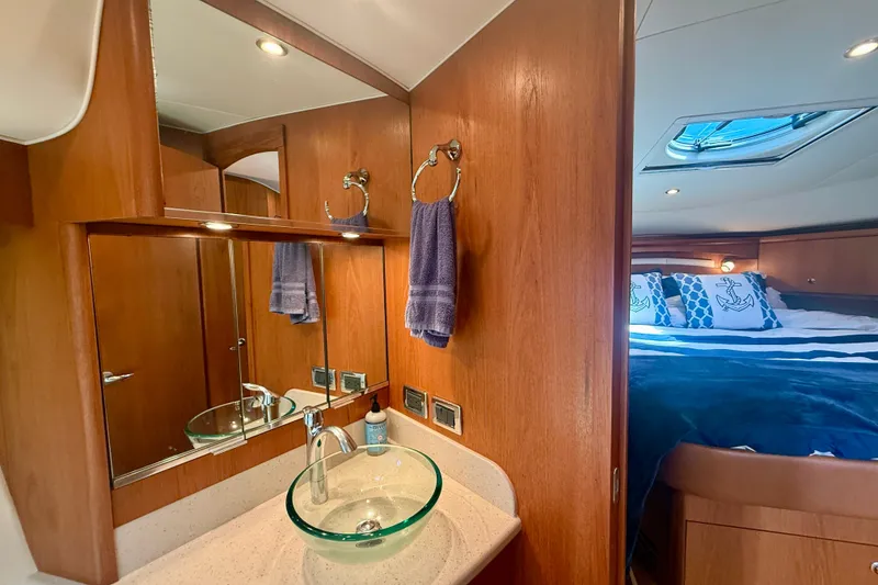 Slide: The Image of Luxurious 2012 Tiara Yachts 4500 Sovran interior with elegant bathroom and cozy bedroom. - 39