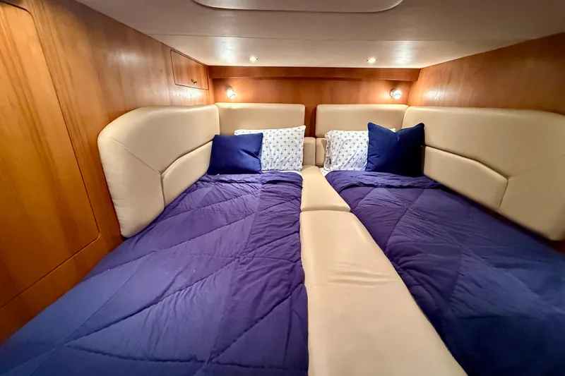 Slide: The Image of Luxurious cabin interior of 2012 Tiara Yachts 4500 Sovran with plush bedding. - 41