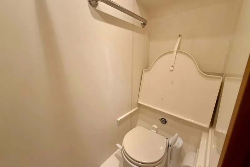Slide: The Image of Bathroom interior of 2012 Tiara Yachts 4500 Sovran, featuring compact toilet design. - 44