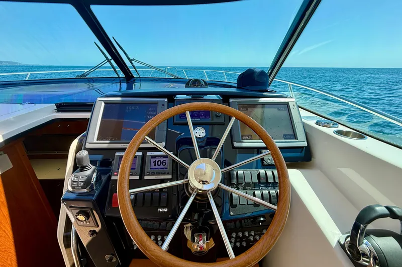 Slide: The Image of Helm of 2012 Tiara Yachts 4500 Sovran with navigation screens and ocean view. - 48