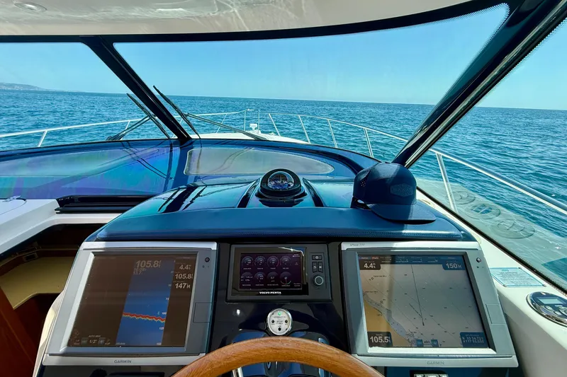 Slide: The Image of Cockpit view of 2012 Tiara Yachts 4500 Sovran navigating open sea. - 49