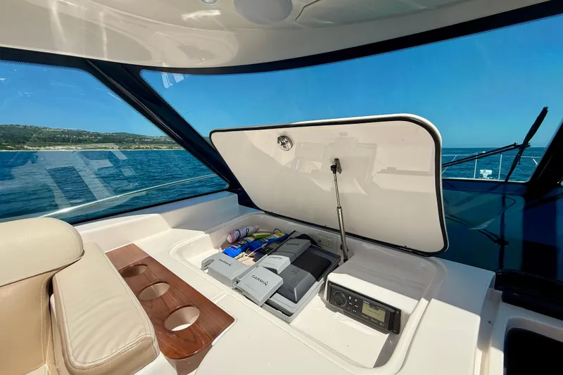 Slide: The Image of Interior view of 2012 Tiara Yachts 4500 Sovran with open storage compartment. - 50