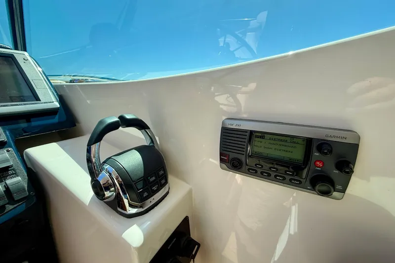 Slide: The Image of Control panel of a 2012 Tiara Yachts 4500 Sovran with Garmin VHF 200 radio. - 51