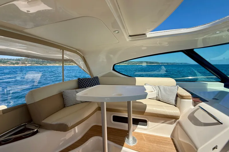Slide: The Image of Luxurious interior of 2012 Tiara Yachts 4500 Sovran with ocean view and plush seating. - 52