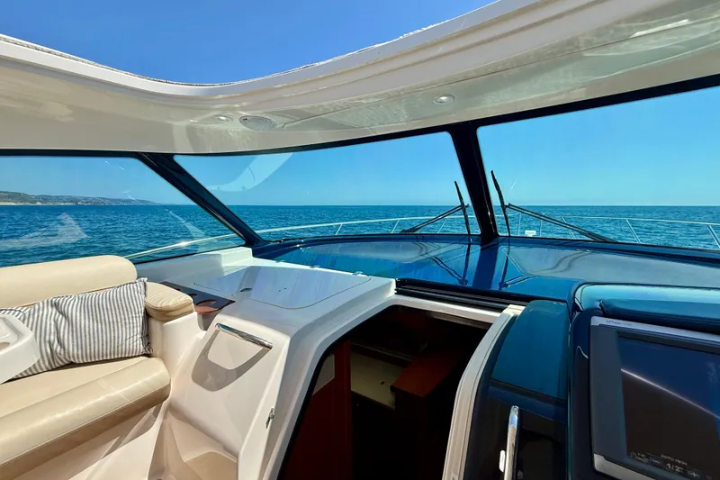 Slide: The Image of Interior view of 2012 Tiara Yachts 4500 Sovran, showcasing luxurious seating and ocean view. - 53