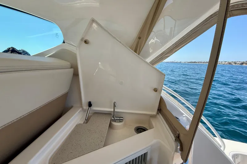 Slide: The Image of Interior view of 2012 Tiara Yachts 4500 Sovran with sink and ocean backdrop. - 56