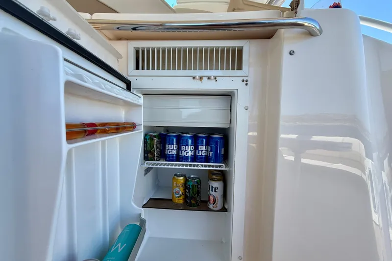 Slide: The Image of Mini fridge stocked with drinks on a 2012 Tiara Yachts 4500 Sovran. - 57