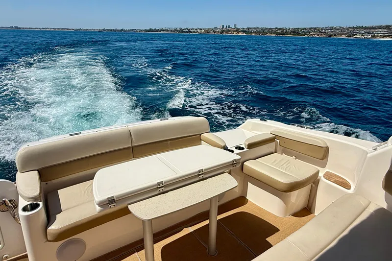 Slide: The Image of Luxury seating on 2012 Tiara Yachts 4500 Sovran, cruising on open blue waters. - 58