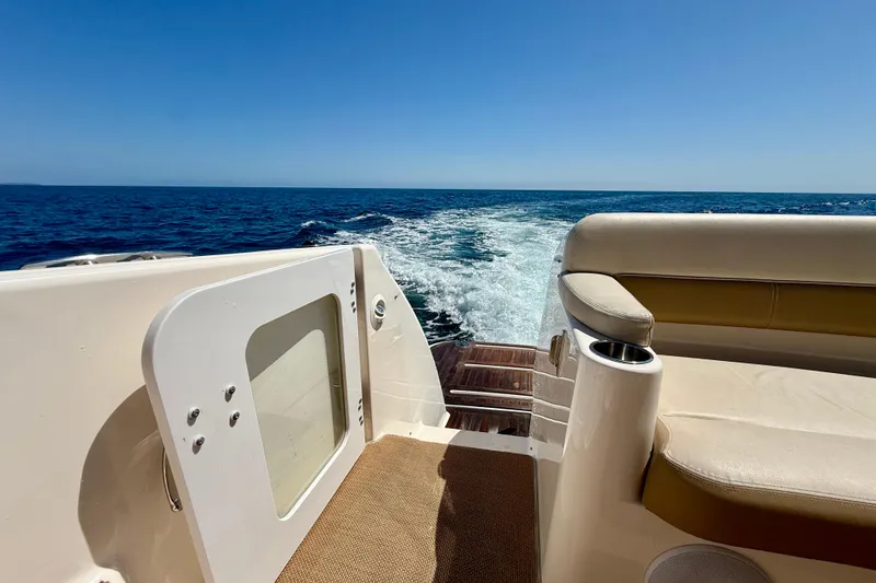 Slide: The Image of Tiara Yachts 4500 Sovran 2012 cruising on open sea, view from deck seating area. - 63