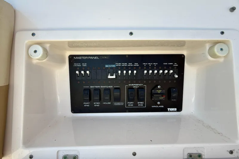 Slide: The Image of Control panel of a 2012 Tiara Yachts 4500 Sovran, featuring switches and indicators. - 65