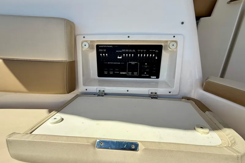 Slide: The Image of Control panel on a 2012 Tiara Yachts 4500 Sovran, featuring beige seating. - 66